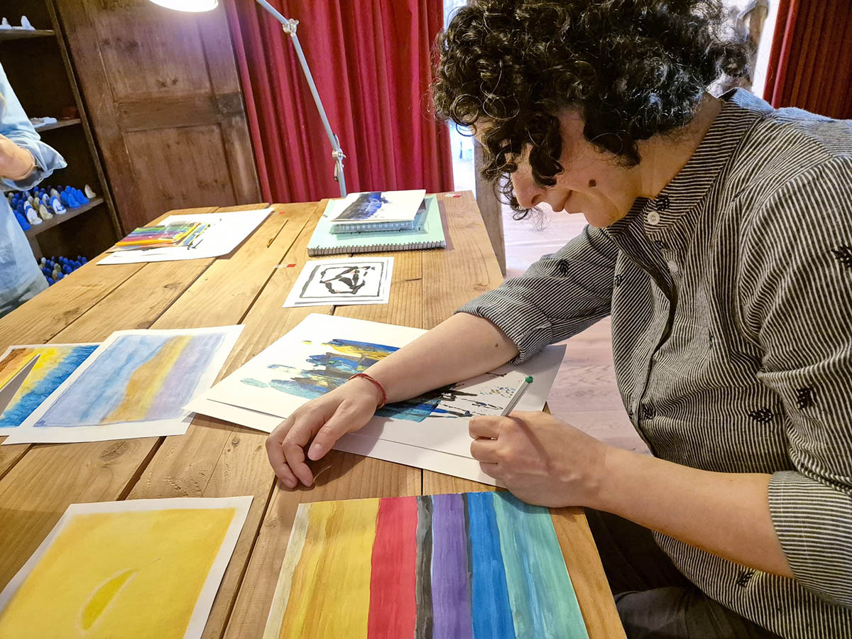 Dharma signing a painting Photo of Dharma signing a painting